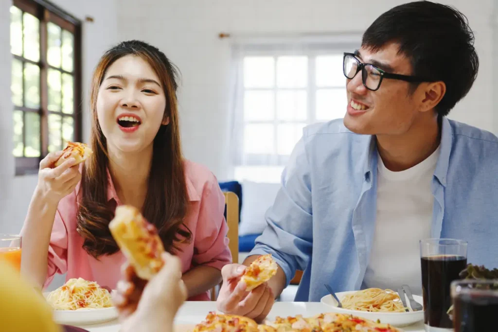 Family enjoying pizza delivery together at home during a casual shared meal
