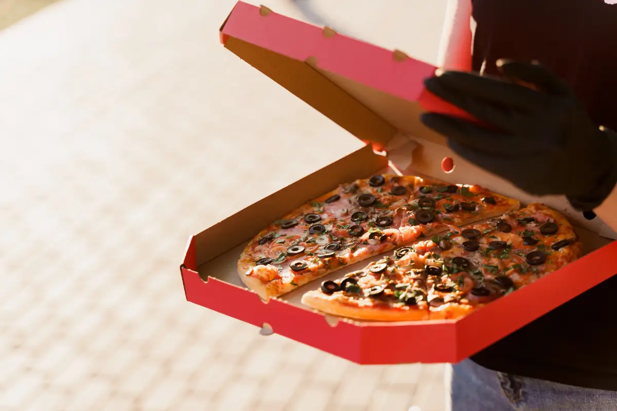 Fresh pizza in an open box ready for pizza takeaway